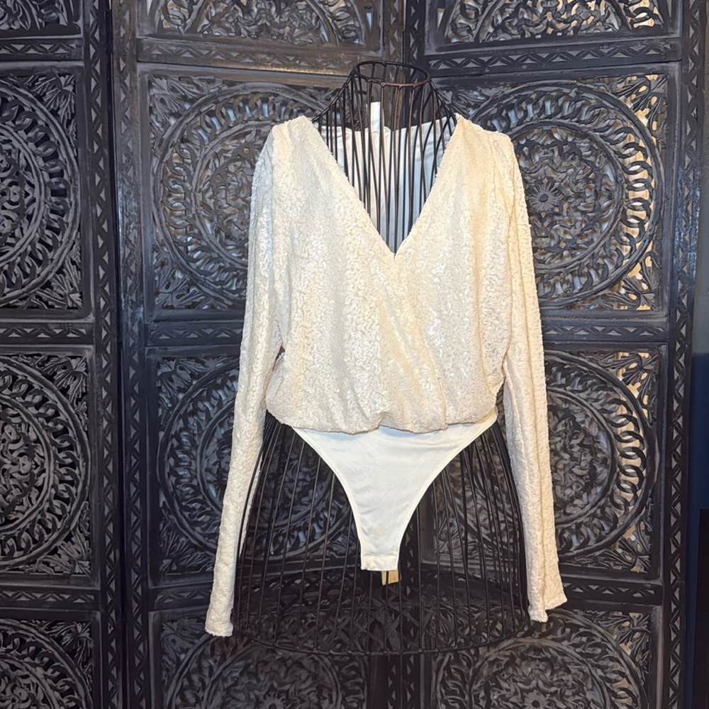adorable cream colored bodysuit with nice sequin design pre-loved